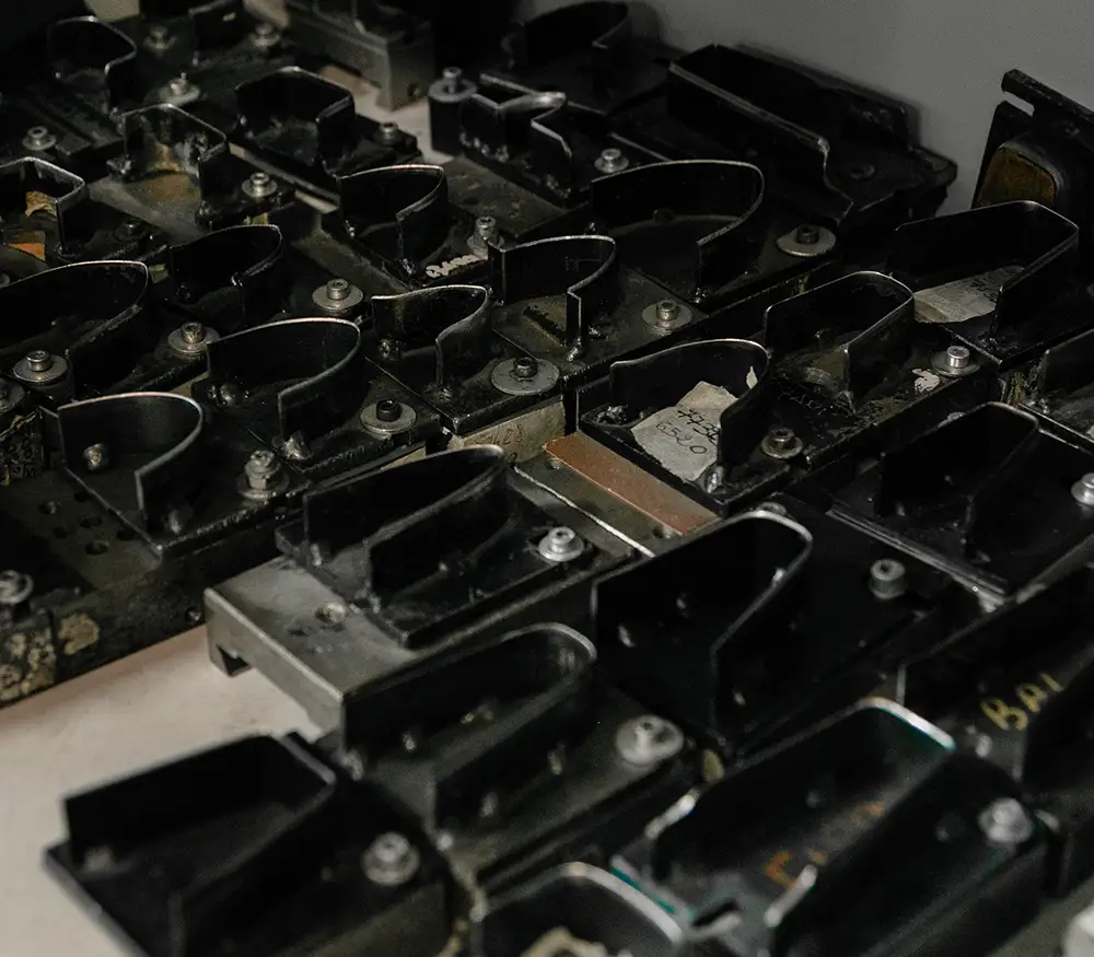 Artisanal belt factory Made in Italy - Balzani - the photo shows a set of molds for customizing belt tips
