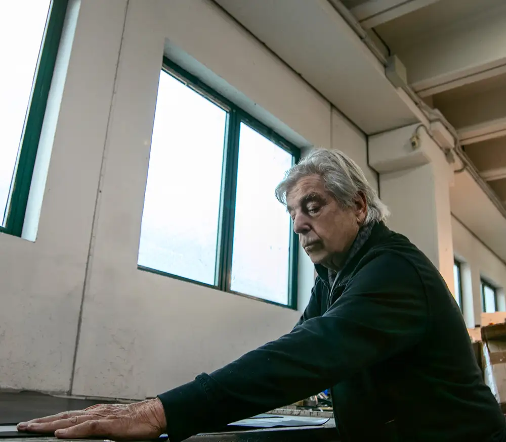 Italian artisanal belts - Renzo Balzani demonstrating how leather is cut